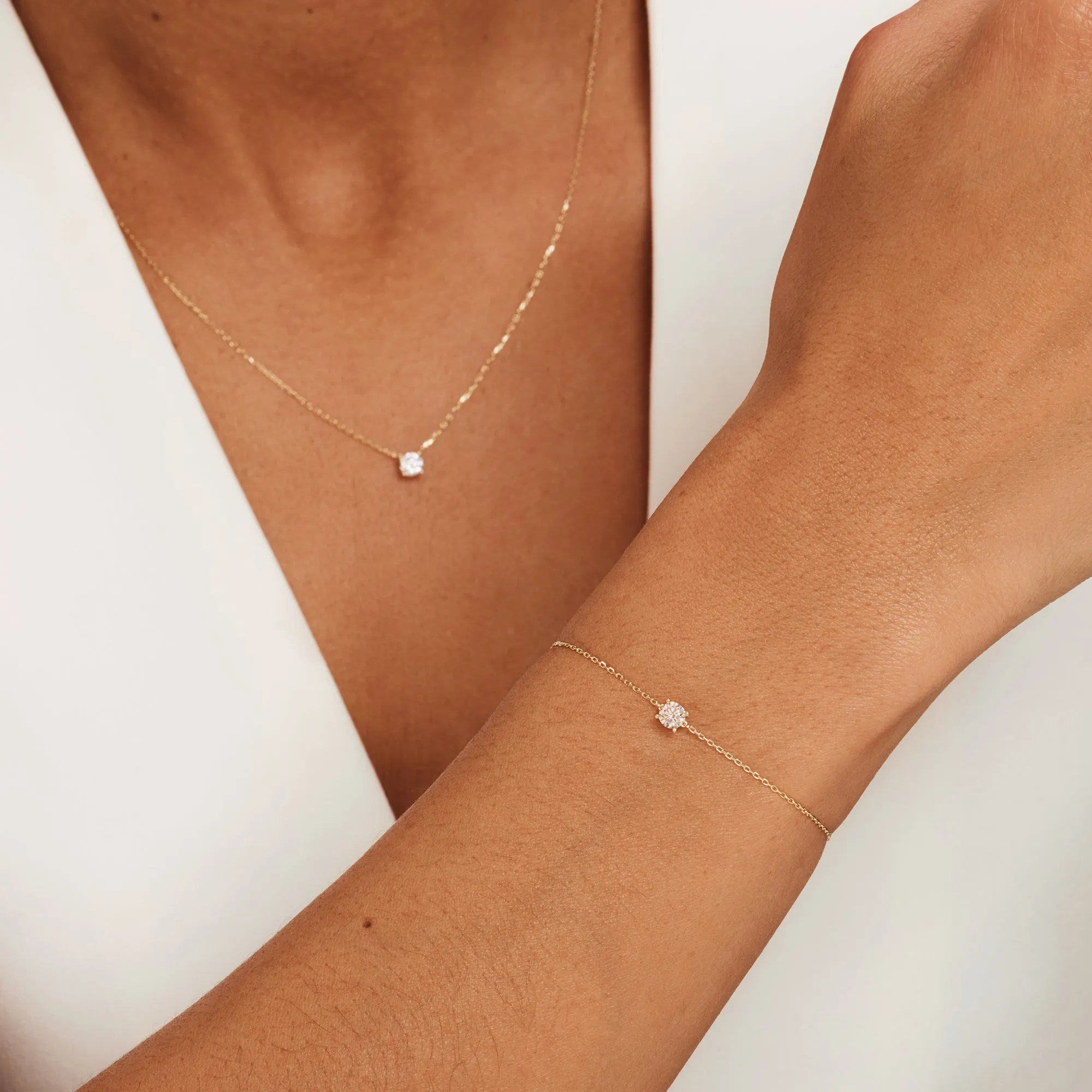 Cadeau d'Isabel 14 karat gold necklace & bracelet set with zirconia