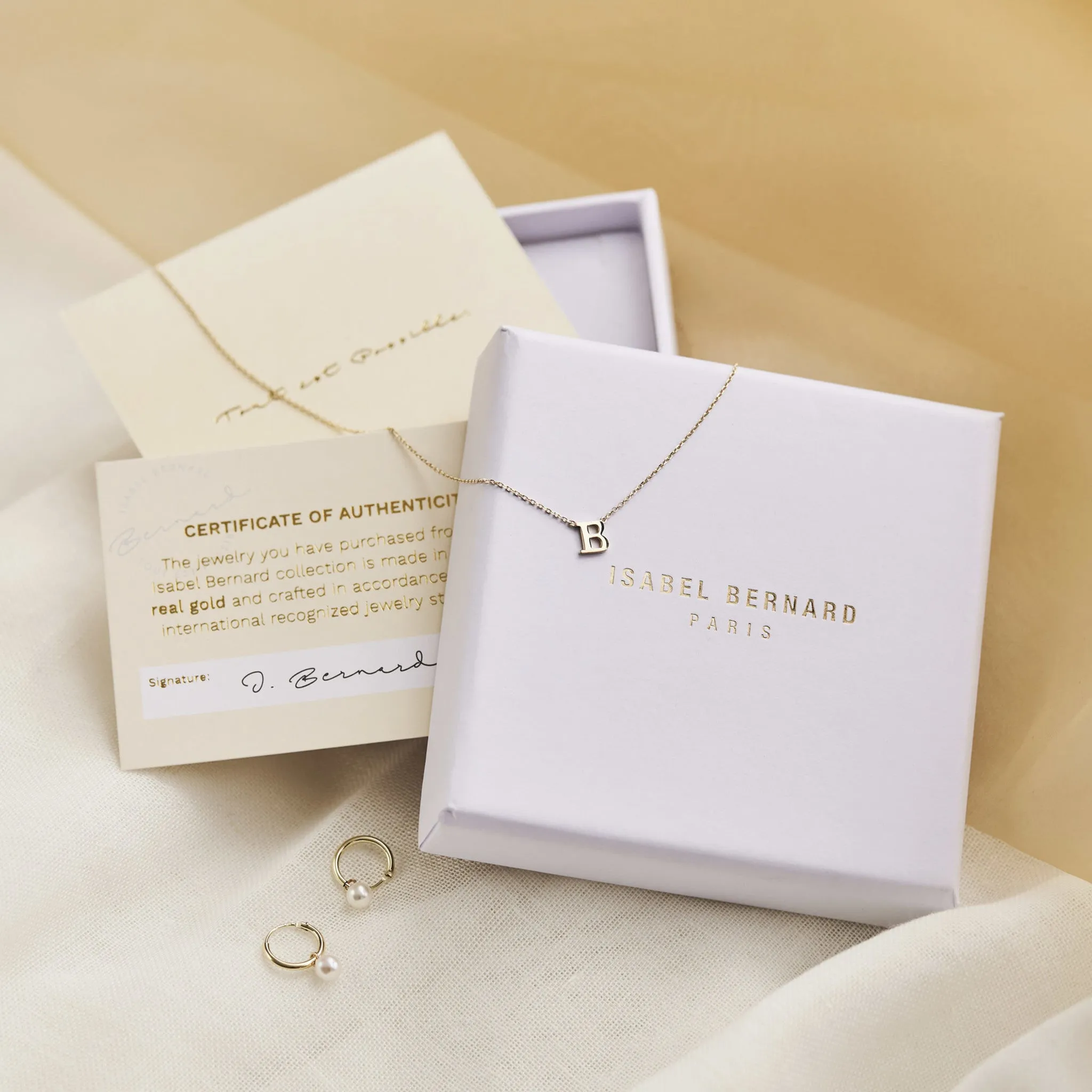 Cadeau d'Isabel 14 karat gold necklace & bracelet set with zirconia