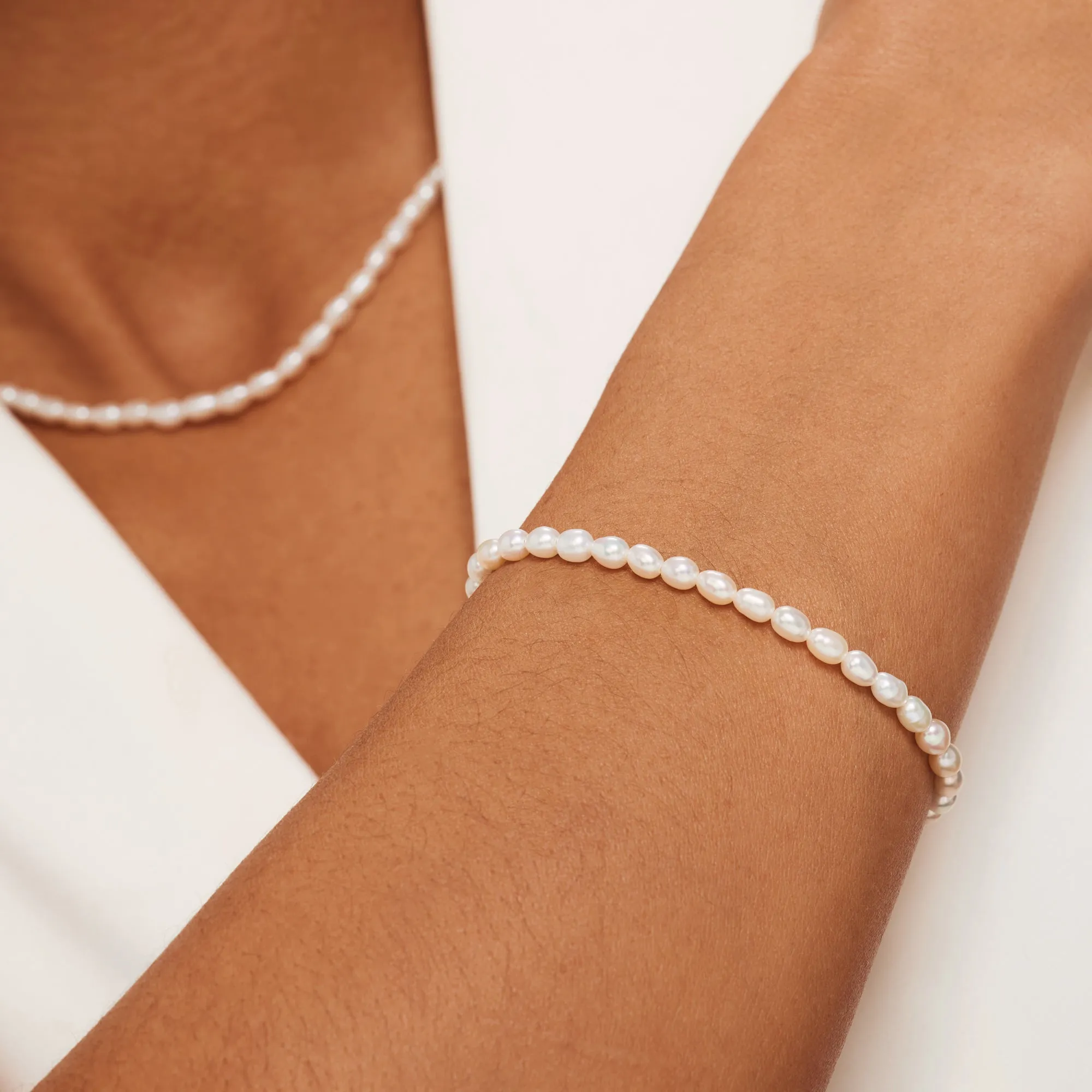 Cadeau d'Isabel 14 karat gold necklace and bracelet with pearls