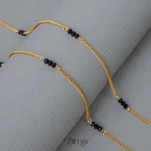 KT1011131 - Gold Toned Black bead pair Anklet